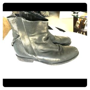 Men’s black leather designer ankle boots.